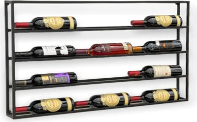 A black metal wine rack mounted on a white wall, holding several bottles of wine.