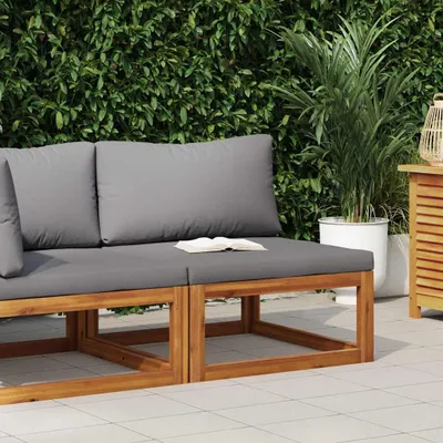 An outdoor seating area with a modular sofa and plants.
