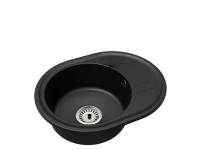 A black granite kitchen sink with a drainboard, shown from a slightly elevated angle against a white background.