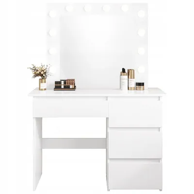 A white makeup vanity with a lighted mirror and drawers, with some cosmetic items on top.