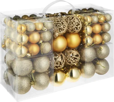 A clear, well-lit studio shot of a set of gold Christmas ornaments in a transparent plastic box.