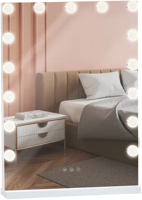 A bedroom scene with a vanity mirror, bed, and nightstand.
