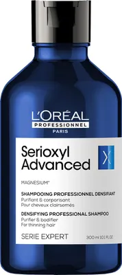 A product shot of a L'Oréal Professionnel shampoo bottle.