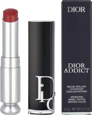 A lipstick and its packaging are displayed against a white background.