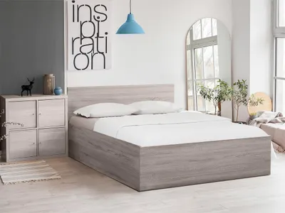 A bedroom scene with a bed, nightstand, and artwork.