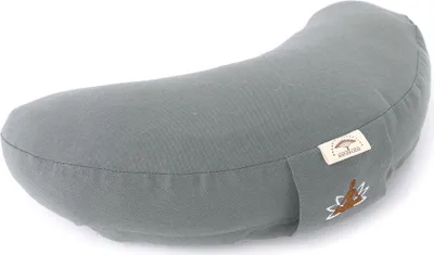 A gray crescent-shaped cushion with a small tag and embroidered design on the side, isolated on a white background.