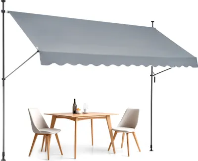 An outdoor dining set with a gray awning.