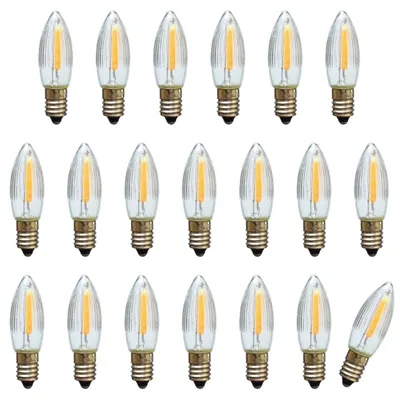 A collection of LED filament bulbs arranged in rows on a white background.