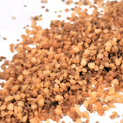 A close-up, overhead view of a pile of streusel or crumble topping.