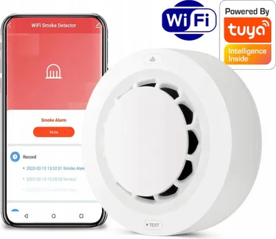 A smartphone displaying a smoke detector app next to a white smoke detector device.
