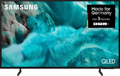 A Samsung QLED TV displaying a vibrant, abstract image.