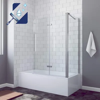 A modern bathroom with a bathtub and a glass shower screen.