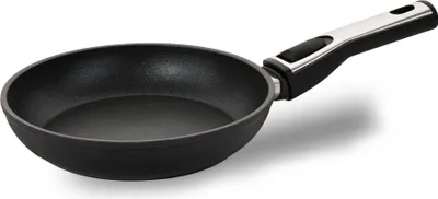 A black frying pan with a silver and black handle is shown against a white background.