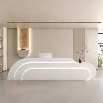 A modern reception desk in a clean, minimalist setting.