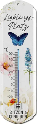 A thermometer with a decorative design featuring a butterfly, flowers, and text.