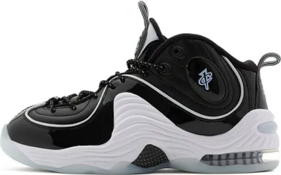 A side view of a black and white Nike Air Penny 2 sneaker against a white background.