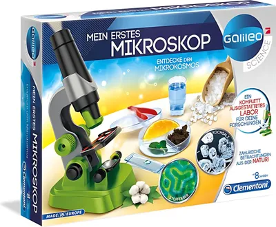 The image shows the packaging of a children's microscope kit, with the microscope and various accessories displayed on a colorful background.