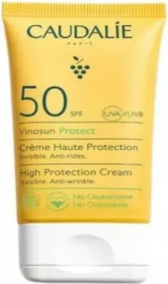 A close-up studio shot of a yellow tube of Caudalie Vinosun Protect High Protection Cream SPF50.