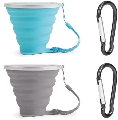 Imagen del producto de Juego de dos vasos de silicona:- Se pueden abrir con una mano.- Ideales para viajes.- Con tapa.- Ligeros.- Con mosquetón.- Vasos plegables