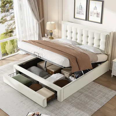 A white upholstered bed with storage drawers is shown in a bedroom setting.