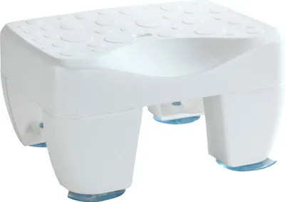 A white bath stool with blue suction cups on a white background.