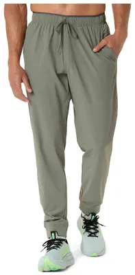 Productafbeelding van Joggingbroek Asics COMFORT CORE STRETCH WOVEN PANT voor Heren