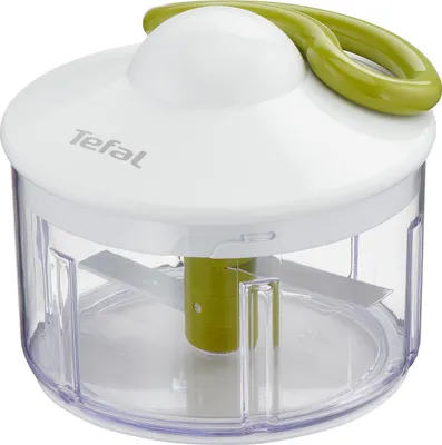 A close-up studio shot of a white and green manual food chopper.