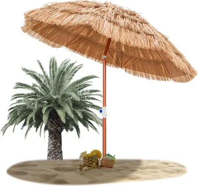 A straw beach umbrella with a palm tree and tropical drinks on sand.