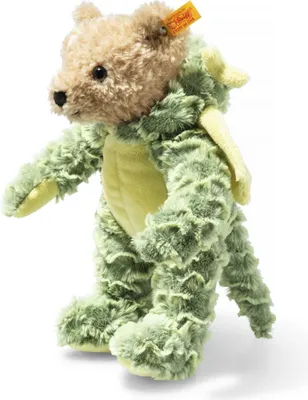 A Steiff teddy bear dressed as a green dragon.