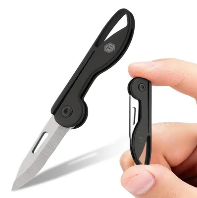 Immagine prodotto di Coltello tascabile pieghevole mini, titanio TC4, impugnatura, lama in acciaio 7Cr17Mov, colore nero, leggero, ideale per l'uso quotidiano, portachiavi