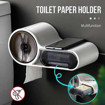 A multi-functional toilet paper holder with a phone stand and storage compartment, mounted on a dark wall next to a toilet.