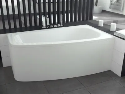 A white corner bathtub with a chrome faucet is shown in a modern bathroom setting.