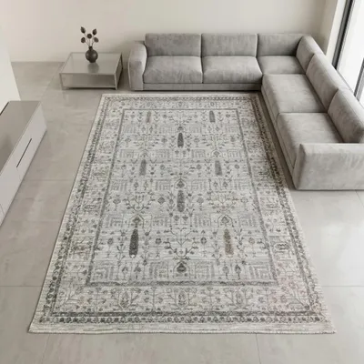 Image de Tapis crème robuste avec franges, motifs ornementaux et bordure. Dimensions : 120 x 160 cm