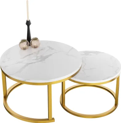 Two round nesting coffee tables with a marble-like top and gold metal legs, decorated with a candle and two small candle holders.