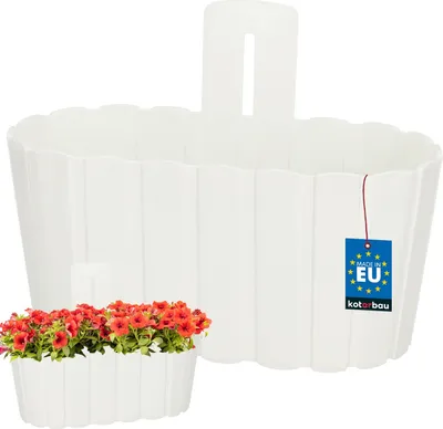 A white hanging planter with flowers and a 'Made in EU' tag.