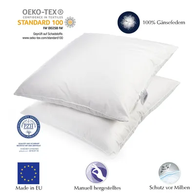 Two white pillows stacked on top of each other, with various certification logos and text overlays.