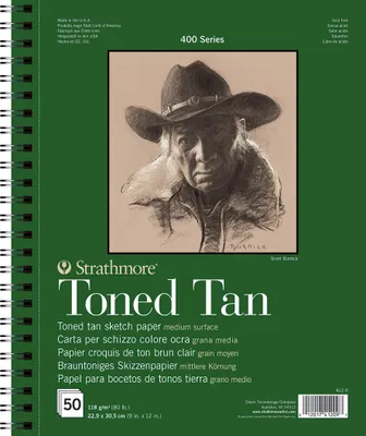 A sketchbook with a charcoal drawing of a man in a cowboy hat on the cover.