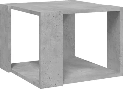 A concrete cube-shaped table or shelf.