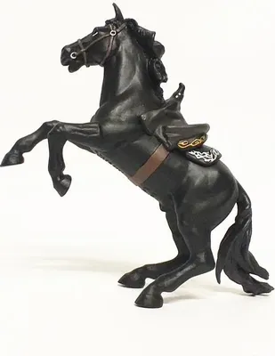 A black horse figurine rearing up, with a saddle.