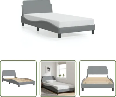 A bed frame with a mattress shown from a slightly elevated angle.