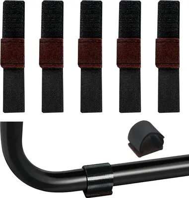 Several black Velcro straps with brown accents are laid out, and one strap is shown wrapped around a black metal rod.