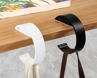 Produktbild von Unyqoos® Handtaschenhaken 2er-Set – rutschfeste, robuste C‑förmige Tischhaken für Schreibtisch & Büro, 7,9 x 9,5 cm, 0,5 kg/Stück