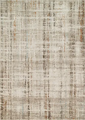 A close-up view of a rug with a distressed, plaid-like pattern.