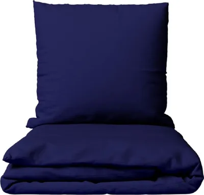 A folded dark blue duvet cover and a dark blue pillowcase are stacked on top of each other against a white background.