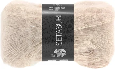 A ball of beige yarn with a black label.
