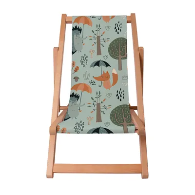 A wooden deck chair with a fabric seat featuring a children's illustration of animals and trees in an autumn forest setting.