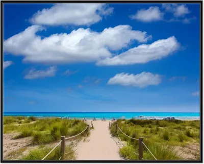 Produktbild von Wallario Wandbild Sandweg zum blauen Meer mit blauem Himmel, Größe: 40,30 x 50,30 cm, Poster mit schwarzem Aluminiumrahmen