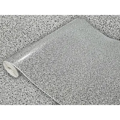 A roll of speckled vinyl wrap is shown, with the pattern appearing to be gray with black flecks.
