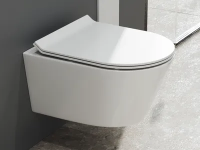 A modern, wall-mounted toilet with a closed lid, shown in a bathroom setting with gray walls and tiled flooring.