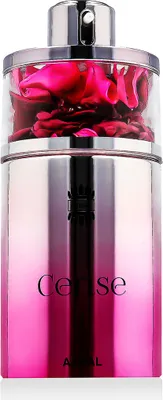 A perfume bottle with pink gradient and rose petals inside.
